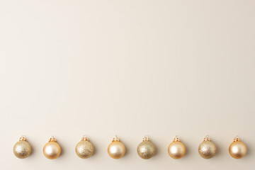 Christmas pastel beige minimal background with beige ball. Flat lay, copy space