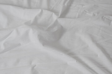 white crumpled sheet with folds close up