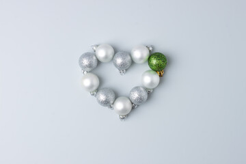Christmas minimal composition with grey balls on grey background. Flat lay, copy space