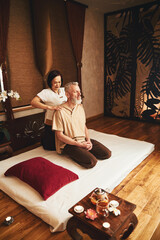 Obraz na płótnie Canvas Grizzled calm male visiting oriental massage centre