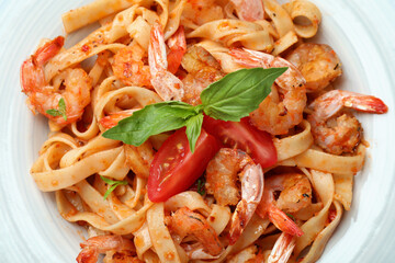 Delicious pasta with tasty shrimps, close up
