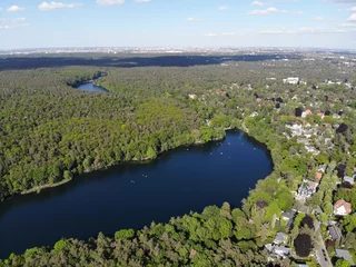 Foto op Canvas Aerial view of Schlachtensee, the most southerly in the Grunewald chain of lakes, which belongs geologically to the Teltow plateau © Sahara Frost