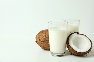 Concept of coconut milk on white background