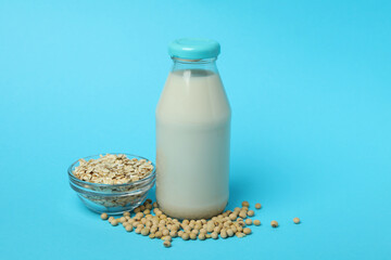 Concept of vegan milk on blue background