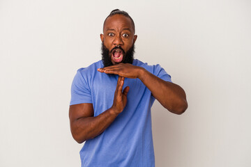 African american man with beard isolated on pink background showing a timeout gesture.