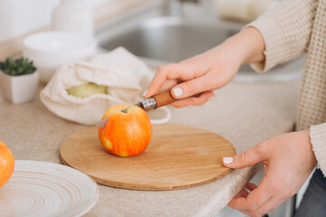 Woman cutting fruits and vegetables