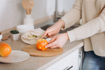 Woman cutting fruits and vegetables