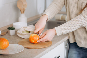 Woman cutting fruits and vegetables