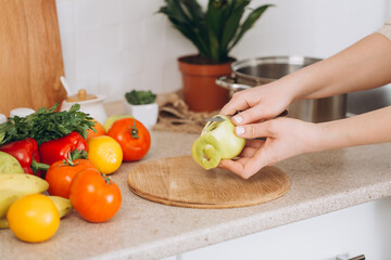 Woman cutting fruits and vegetables