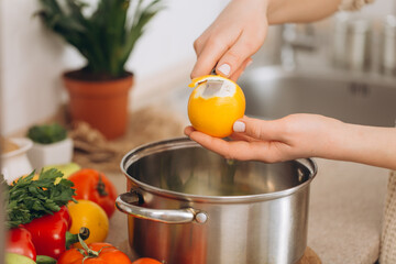 Woman cutting fruits and vegetables