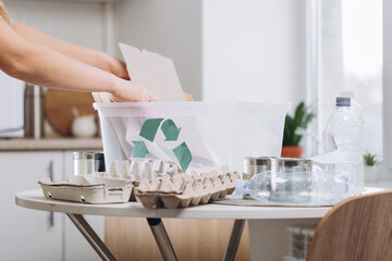 Woman sorting waste at home, storage and recycling concept.Zero waste