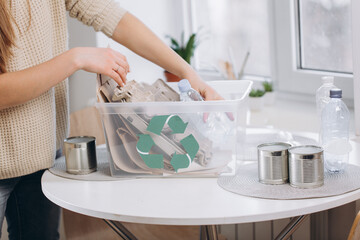 Woman sorting waste at home, storage and recycling concept.Zero waste