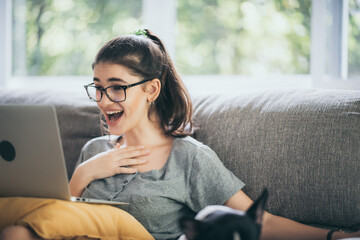 Obraz premium business caucasian woman person using laptop computer to working online business at home, young female sitting indoor lifestyle to work with notebook in term of communication technology