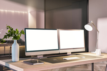 Modern office interior with desk top, blank white computer monitors and other items. Mock up, 3D Rendering.