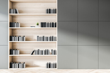 Close up of grey wooden office bookshelf with mockup place on wall. Workplace and items concept. Mock up, 3D Rendering.