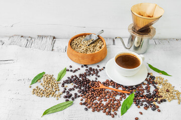 Equipment used to brew coffee drift and coffee beans with a cup of coffee