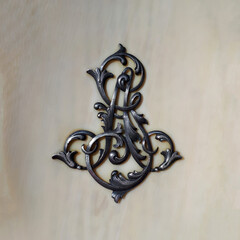 Very beautiful antique silver monogram onlay on ivory, close-up shot, unique items at the flea...