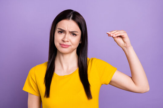 Photo of sad irritated young lady dressed yellow clothes showing blah blah blah gesture isolated purple color background