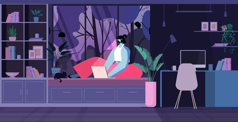 young woman using laptop social media network communication concept dark night living room interior