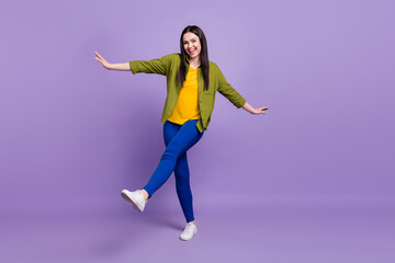 Full body photo of young excited girl happy positive smile playful dance isolated over purple color background