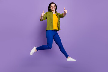 Fototapeta na wymiar Full size profile side photo of young girl happy positive smile jump show thumb-up like cool isolated over violet color background