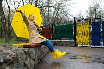 Happy older women having fun outdoor. Senior cheerful mature elderly retired woman with yellow...