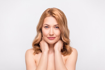 Fototapeta premium Photo portrait woman with naked shoulders touching neck doing skin treatment isolated white color background