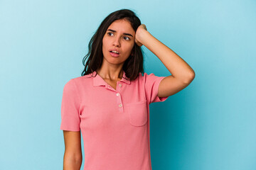 Young caucasian woman isolated on blue background being shocked, she has remembered important...