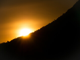 Sun Sets on The Edge of The Mountain