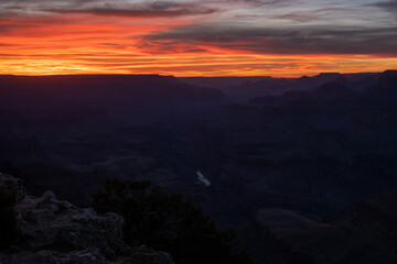Fototapeta na wymiar The Colorado River Glows in the Last Sunlight Over Grand Canyon