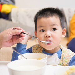 Little chinese boy eating