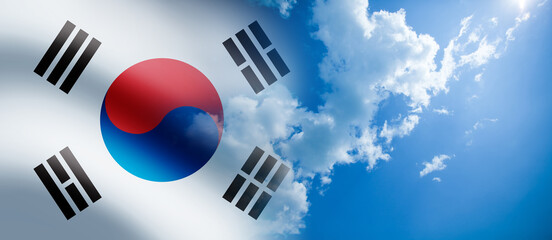 South Korea waving flag on the blue cloudy sky background.