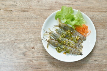 raw mantis shrimp dressing spicy and sour fish sauce Thai food on plate