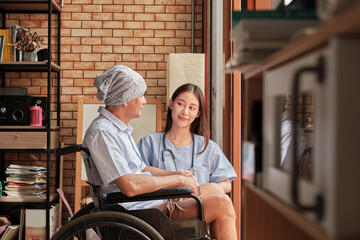 Cancer elderly patients in wheelchairs receive rehabilitation treatment in private home, Asian...