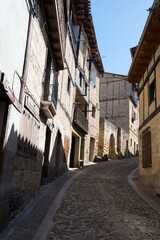 View of old street with traditional architecture and no people at Frias, Merindades, Burgos, Spain, Europe.