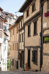 Fototapeta na wymiar Beautiful old street with traditional houses and no people at Frias, Burgos, Merindades, Spain, Europe