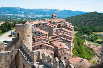 Fototapeta na wymiar Castle towerat Frias and battlements, with the village and mountains in the background. Frias, Burgos, Merindades, Spain , Europe