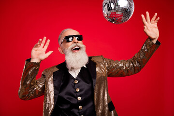 Photo of funny beard elder magician man dance look disco ball wear gold jacket eyewear isolated on...