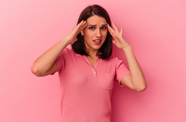 Young caucasian woman isolated on pink background receiving a pleasant surprise, excited and...