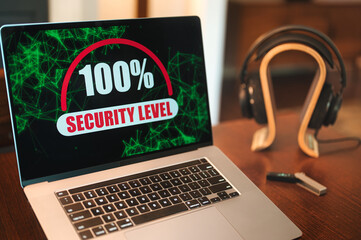 computer security concept with laptop and headphones in background