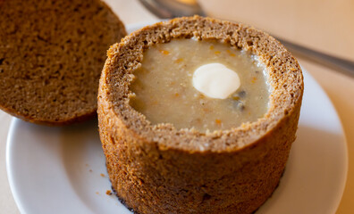 aromatic traditional hot chowder in a bowl of rye bread