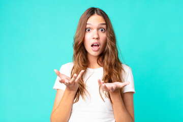 young pretty woman amazed, shocked and astonished with an unbelievable surprise