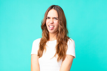 young pretty woman feeling disgusted and irritated and tongue out