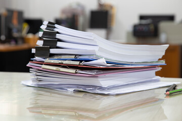 Pile of unfinished documents on office desk, Stack of business paper