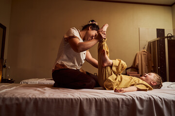 Professional masseuse working in modern spa salon