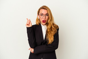 Obraz premium Caucasian business woman wearing a wireless headphones isolated on white background having some great idea, concept of creativity.
