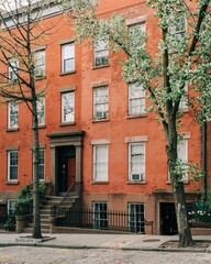 Fototapeta na wymiar Brick residential buildings on Joralemon Street, in Brooklyn Heights, Brooklyn, New York