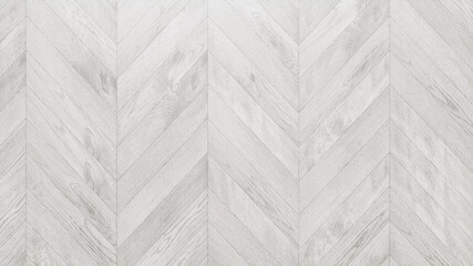 White Wood Background. Wooden Boards arranged in a Chevron Parquet Pattern.