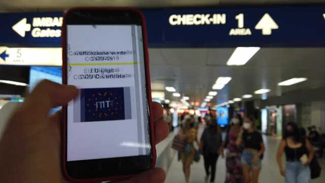Europe, Italy , Linate Airport Milan, Green Pass European Eu Digital Covid-19 Certificate - tourists at the airport resume safe travel after vaccination