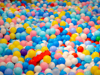 Fototapeta na wymiar Colorful plastic balls in the playground
